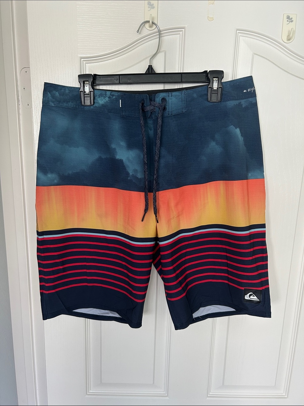 Quiksilver Size 33 Navy Boardshorts with Sunset Orange and Red Stripes